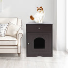 Den Litter Box Cabinet beside a cream sofa with a cat standing on the flat top