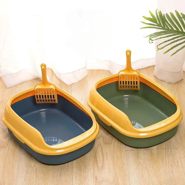 Two Levee High-Sided Litter Boxes in blue and green with yellow rims and orange scoops on a wood floor
