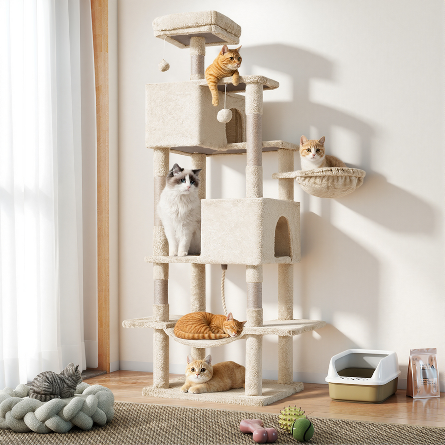 Spire 66-Inch Cat Tree in beige standing in a sunlit room beside a litter box